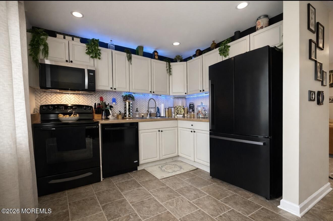 15 Commodore Court Barnegat, NJ 08005 - Photo 4 of 19 a kitchen with a refrigerator and a sink