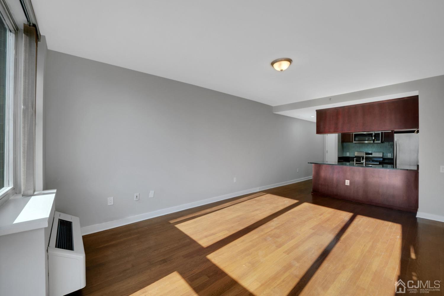 301 Hudson Park Edgewater, NJ 07020 - Photo 2 of 44 a living room with a couch and a flat screen tv