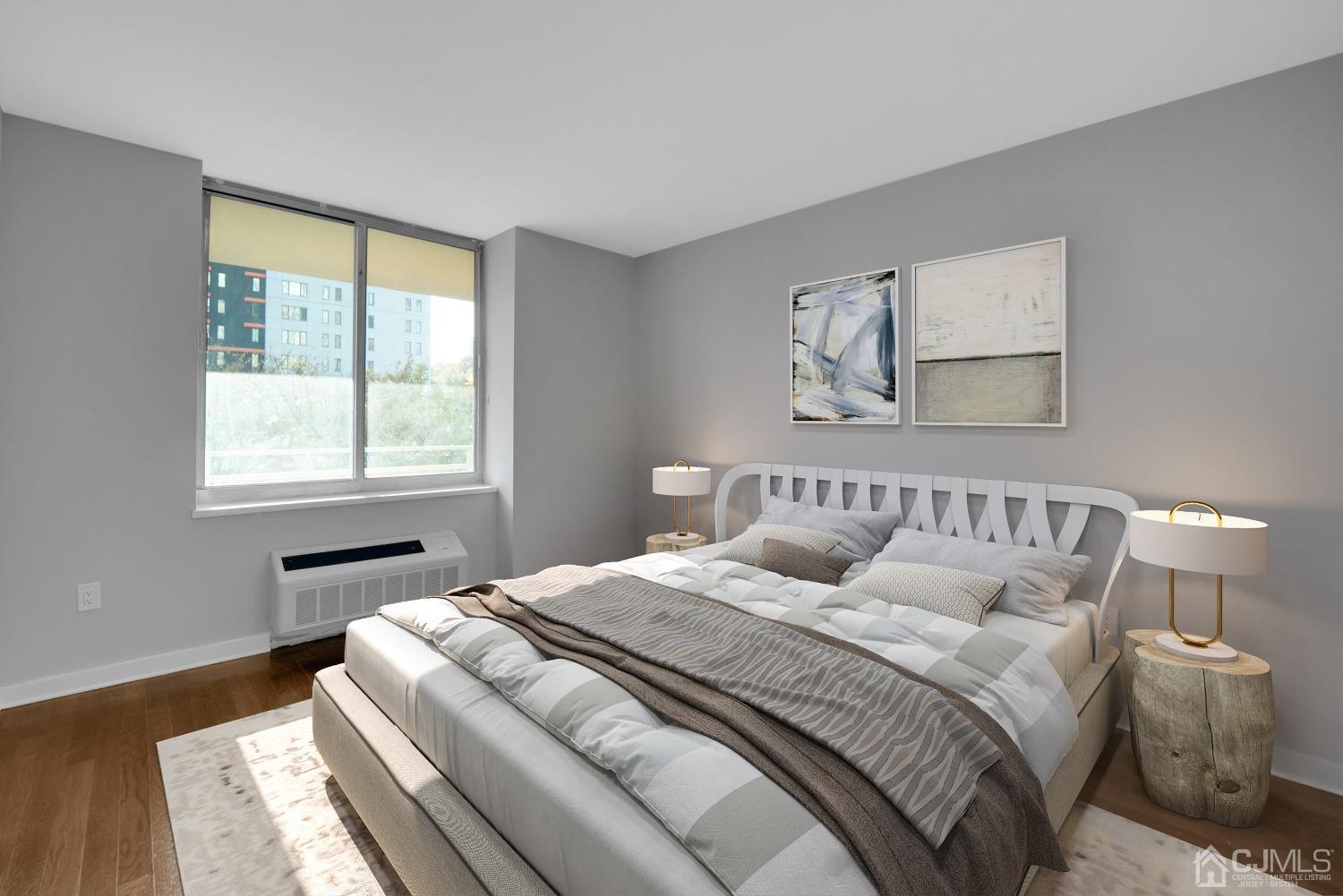 301 Hudson Park Edgewater, NJ 07020 - Photo 22 of 44 a bedroom with a large bed and a window