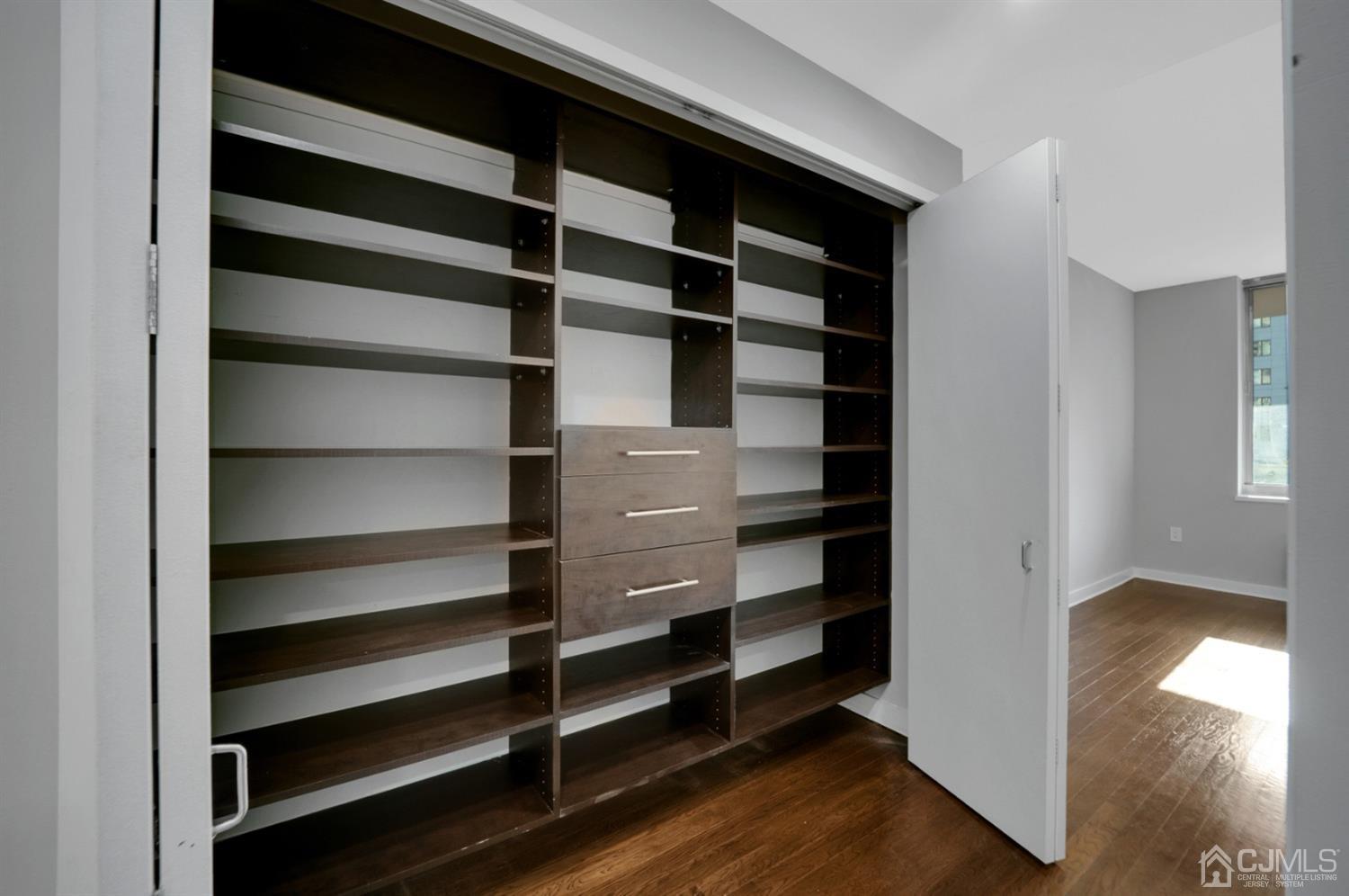 301 Hudson Park Edgewater, NJ 07020 - Photo 26 of 44 a view of walk in closet with empty racks