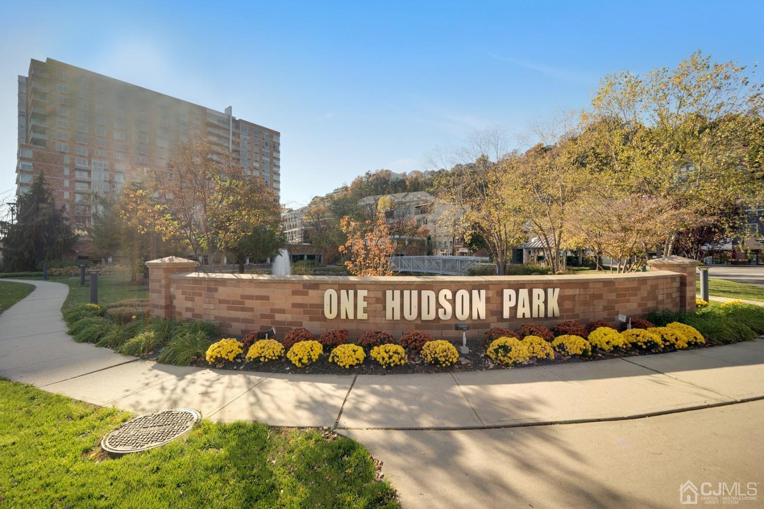 301 Hudson Park Edgewater, NJ 07020 - Photo 3 of 44 a wooden bench sitting in front of a building