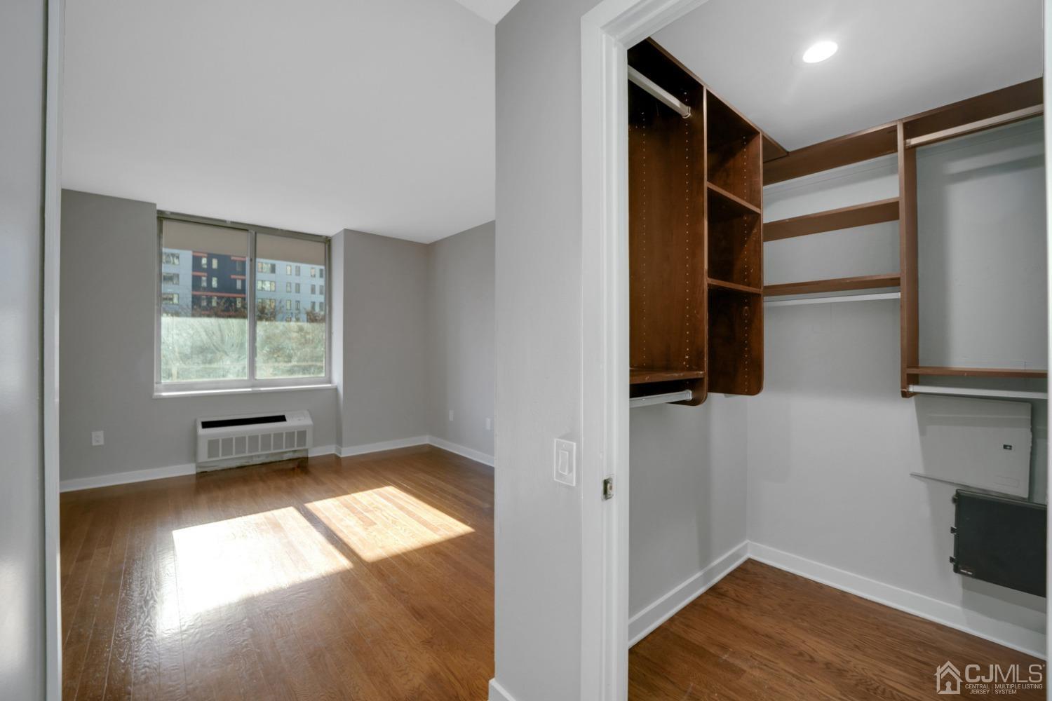 301 Hudson Park Edgewater, NJ 07020 - Photo 31 of 44 a view of empty room with wooden floor and fan
