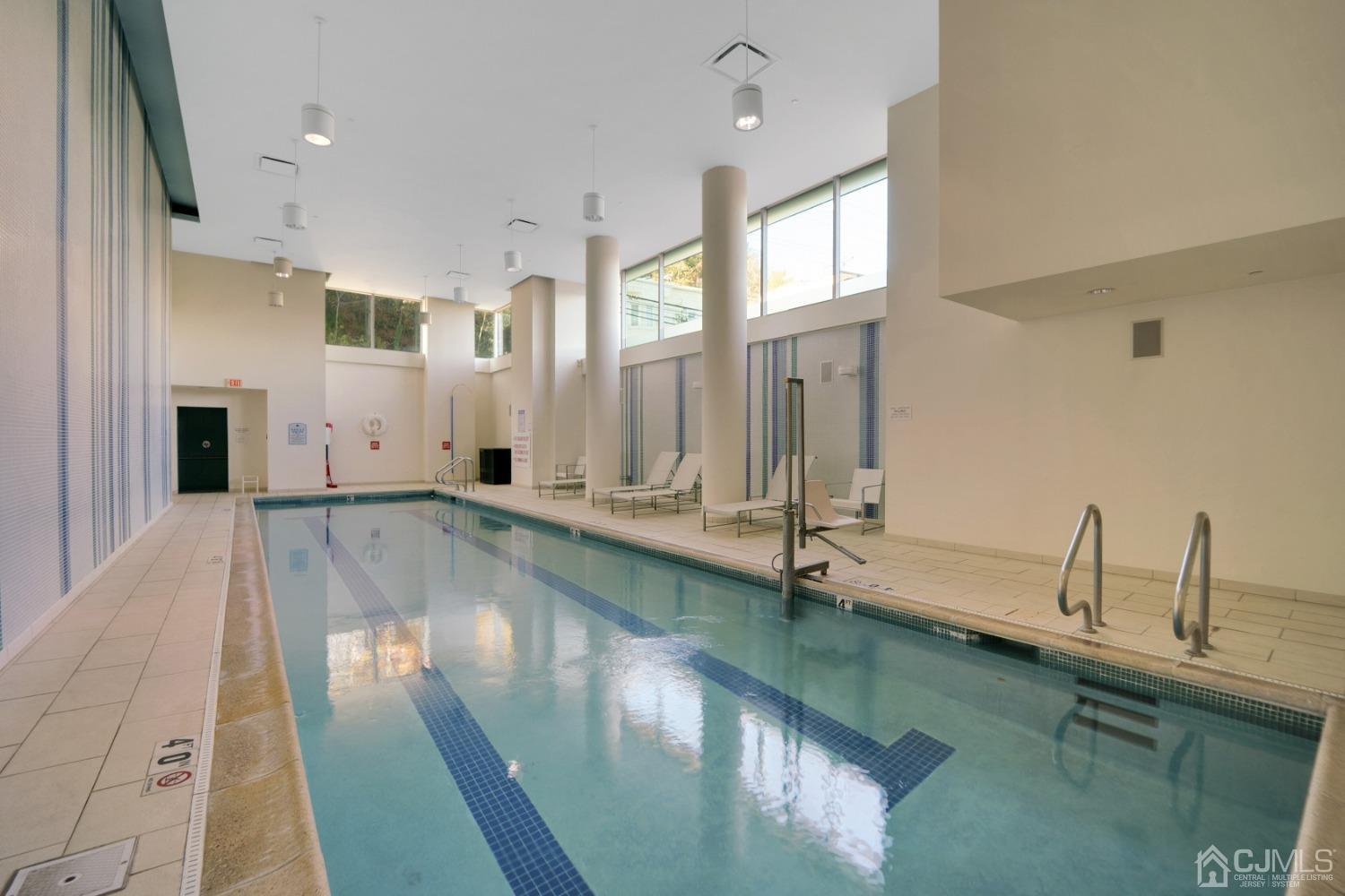 301 Hudson Park Edgewater, NJ 07020 - Photo 34 of 44 a view of a kitchen with kitchen island a large window a sink and stainless steel appliances