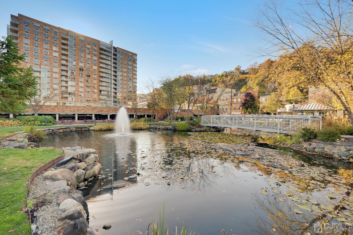 301 Hudson Park Edgewater, NJ 07020 - Photo 4 of 44 a view of a lake with tall buildings