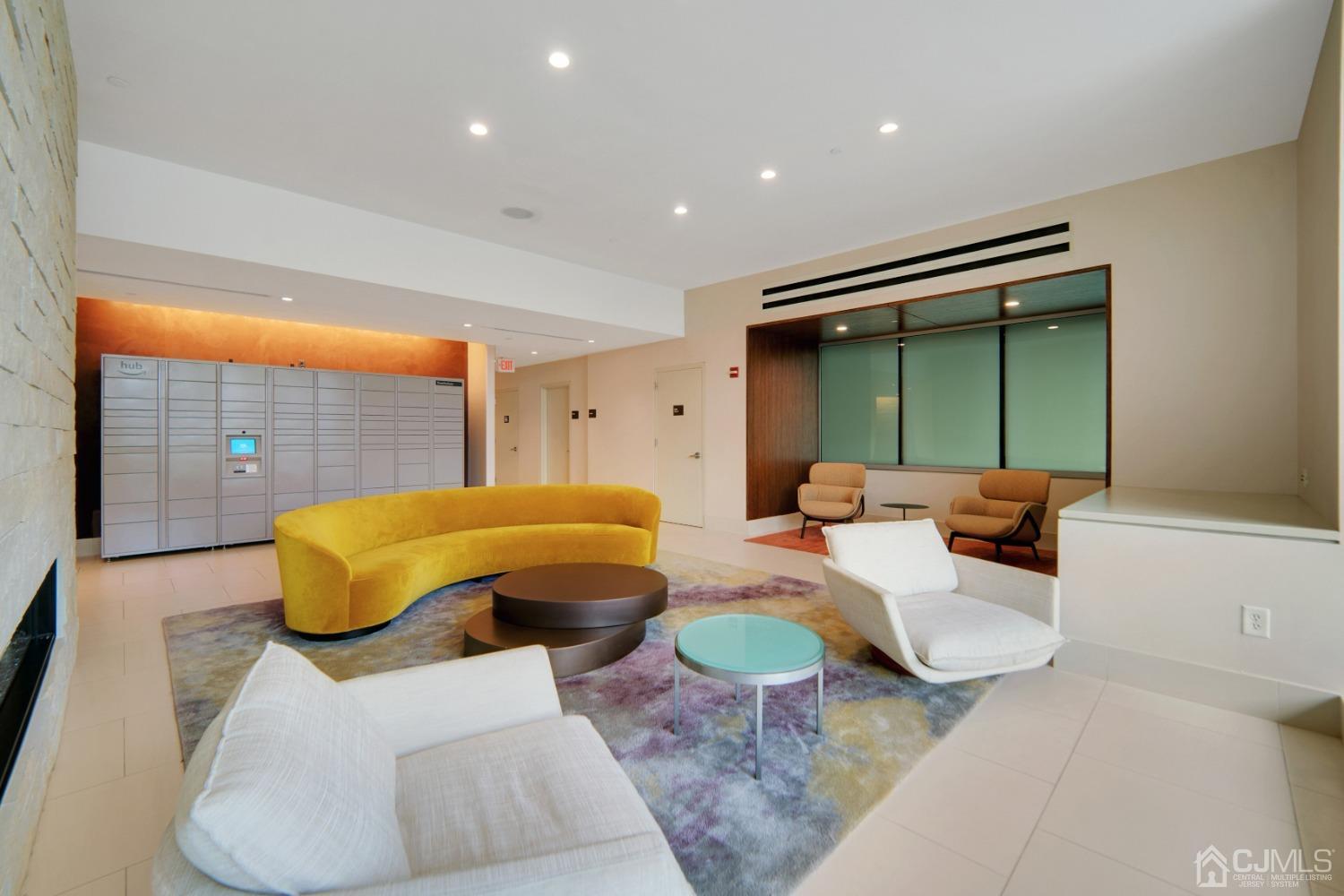 301 Hudson Park Edgewater, NJ 07020 - Photo 5 of 44 a living room with furniture and a large window