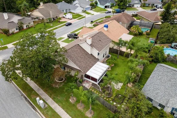 an aerial view of residential house with outdoor space