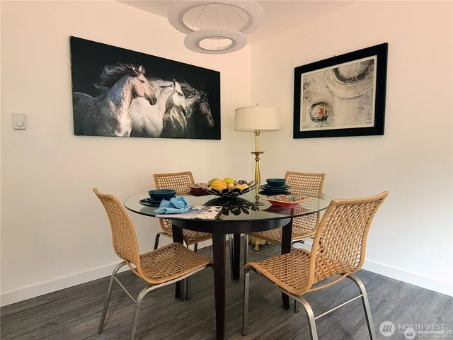 a view of a dining room with furniture and wooden floor