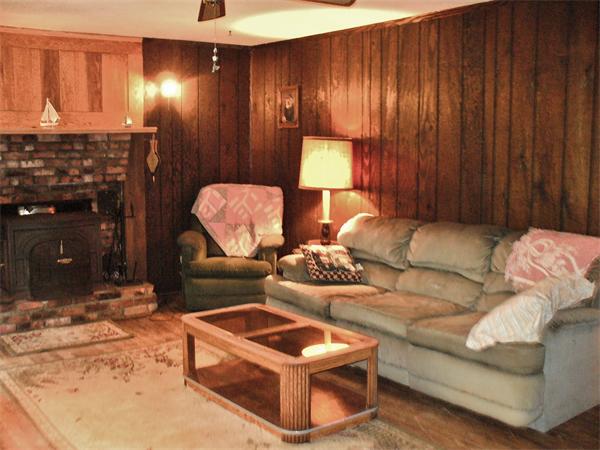 17 North Fitzwilliam Road Royalston, MA 01368 - Photo 5 of 12 a living room with furniture and a fireplace