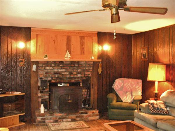 17 North Fitzwilliam Road Royalston, MA 01368 - Photo 6 of 12 a living room with furniture and a fireplace