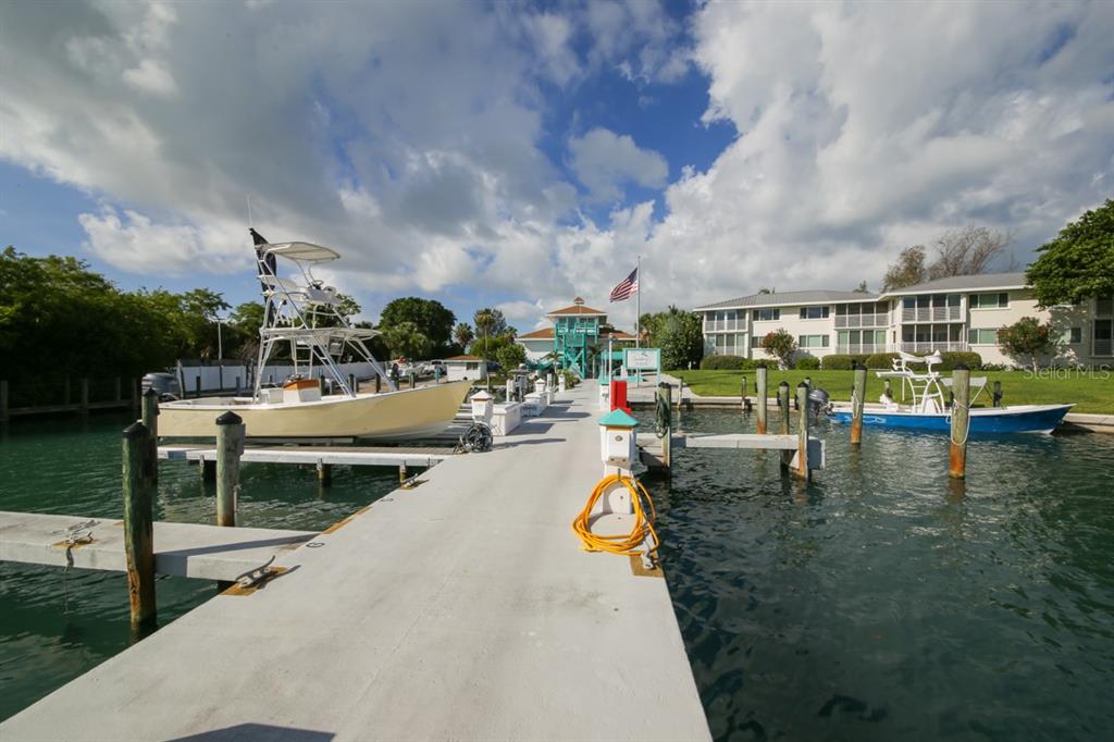 5820 Gasparilla Road, Unit SLIP 29 Boca Grande, FL 33921 - Photo 11 of 22 a view of a swimming pool with a patio