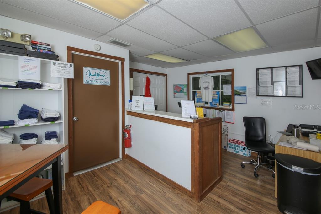 5820 Gasparilla Road, Unit SLIP 29 Boca Grande, FL 33921 - Photo 14 of 22 a workspace with furniture and wooden floor