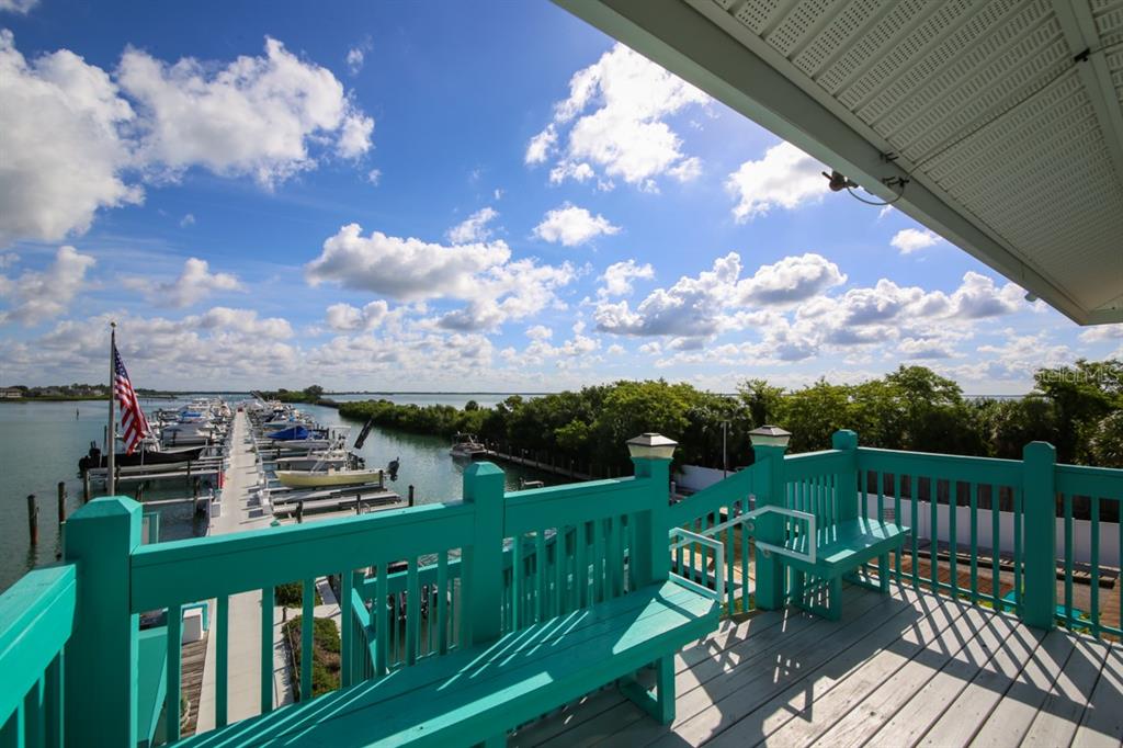 5820 Gasparilla Road, Unit SLIP 29 Boca Grande, FL 33921 - Photo 15 of 22 a view of a balcony with two chairs