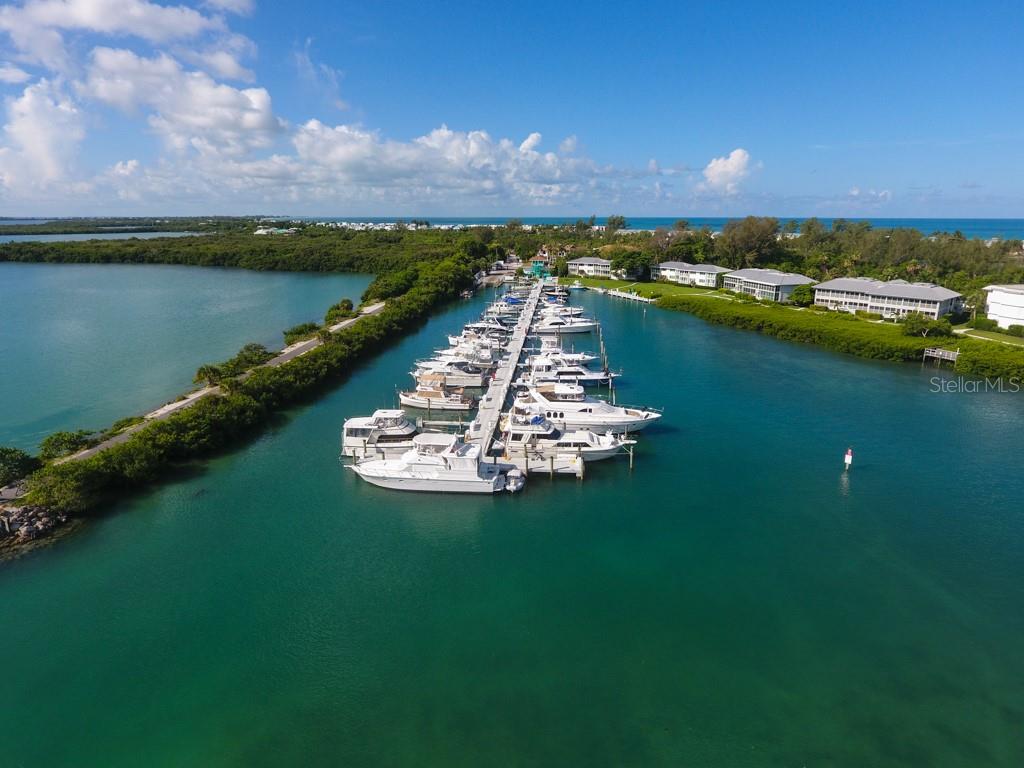 5820 Gasparilla Road, Unit SLIP 29 Boca Grande, FL 33921 - Photo 19 of 22 a view of a lake with a yard