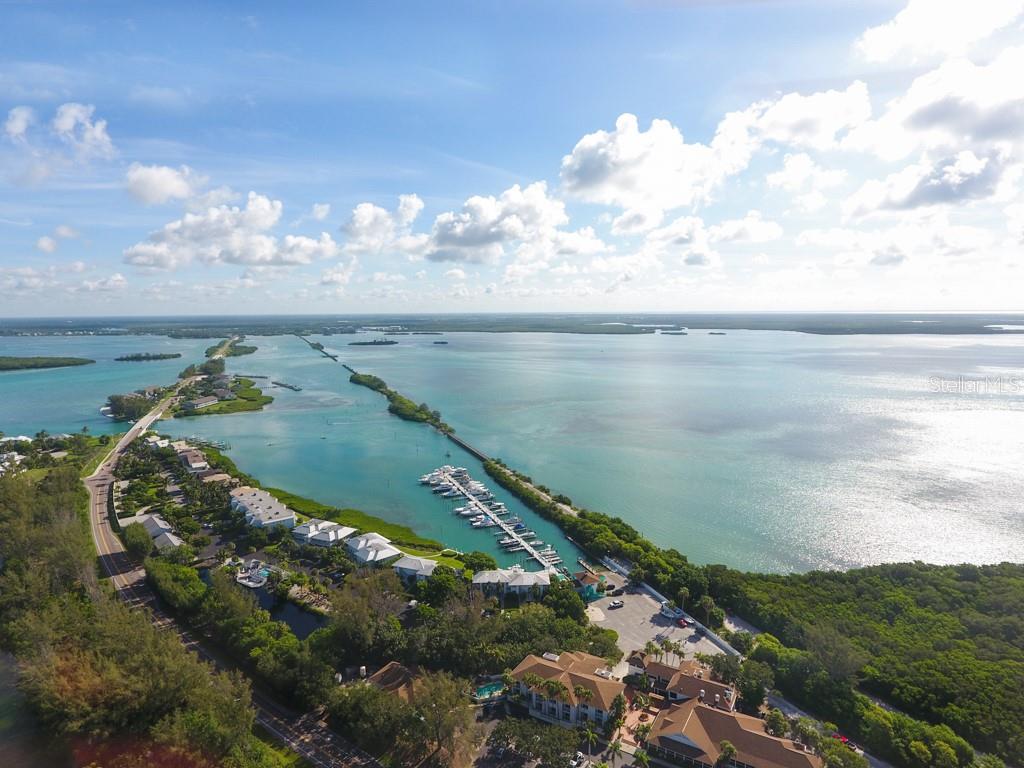 5820 Gasparilla Road, Unit SLIP 29 Boca Grande, FL 33921 - Photo 5 of 22 a view of a lake with a yard