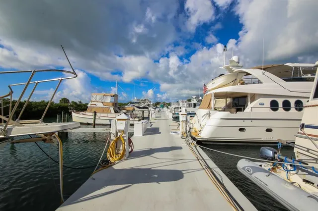 a view of a balcony with chairs and wooden floor