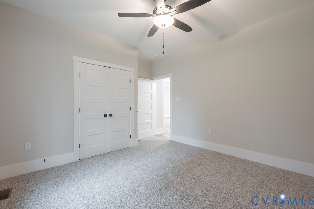 1 Tabscott Road Kents Store, VA 23084 - Photo 23 of 42 Neutral-toned walls complement plush grey carpetin