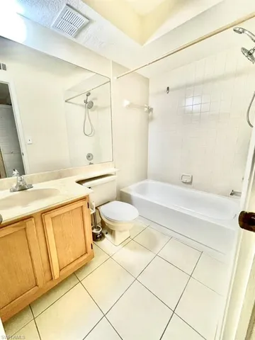 a kitchen with a refrigerator and a sink