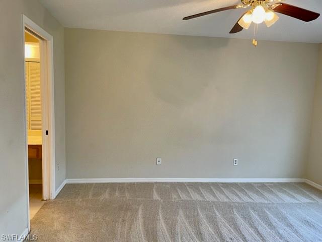 9580 Victoria Lane, Unit A202 Naples, FL 34109 - Photo 13 of 18 an empty room with a empty space and a window