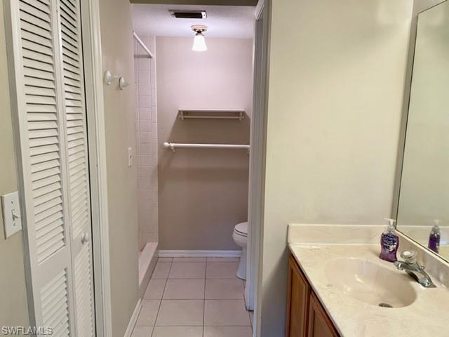 9580 Victoria Lane, Unit A202 Naples, FL 34109 - Photo 15 of 18 a bathroom with a sink and a mirror