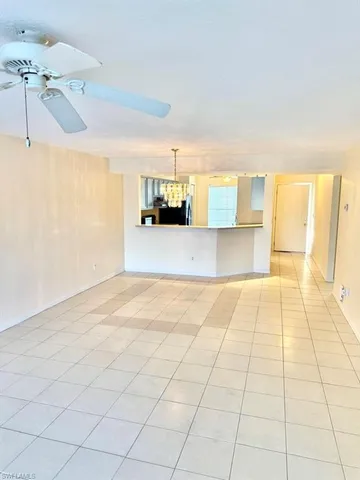a view of a kitchen with kitchen appliances and cabinets