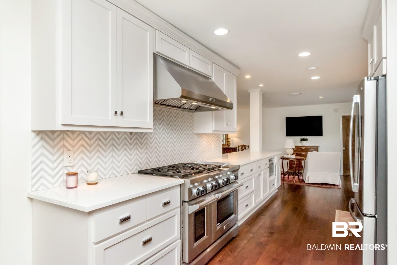 154 Fenwick Road Mobile, AL 36608 - Photo 18 of 48 Kitchen with stainless steel appliances, white cabinetry, dark wood-style flooring, recessed lighting, and backsplash