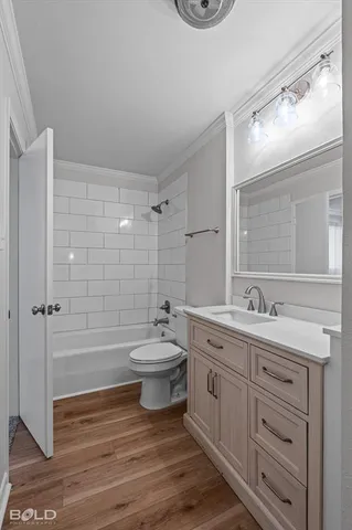 a bathroom with a double vanity sink toilet and shower