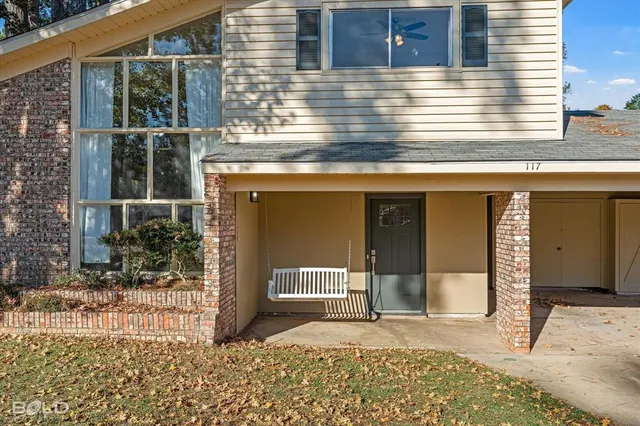 a view of a house with a door and a window