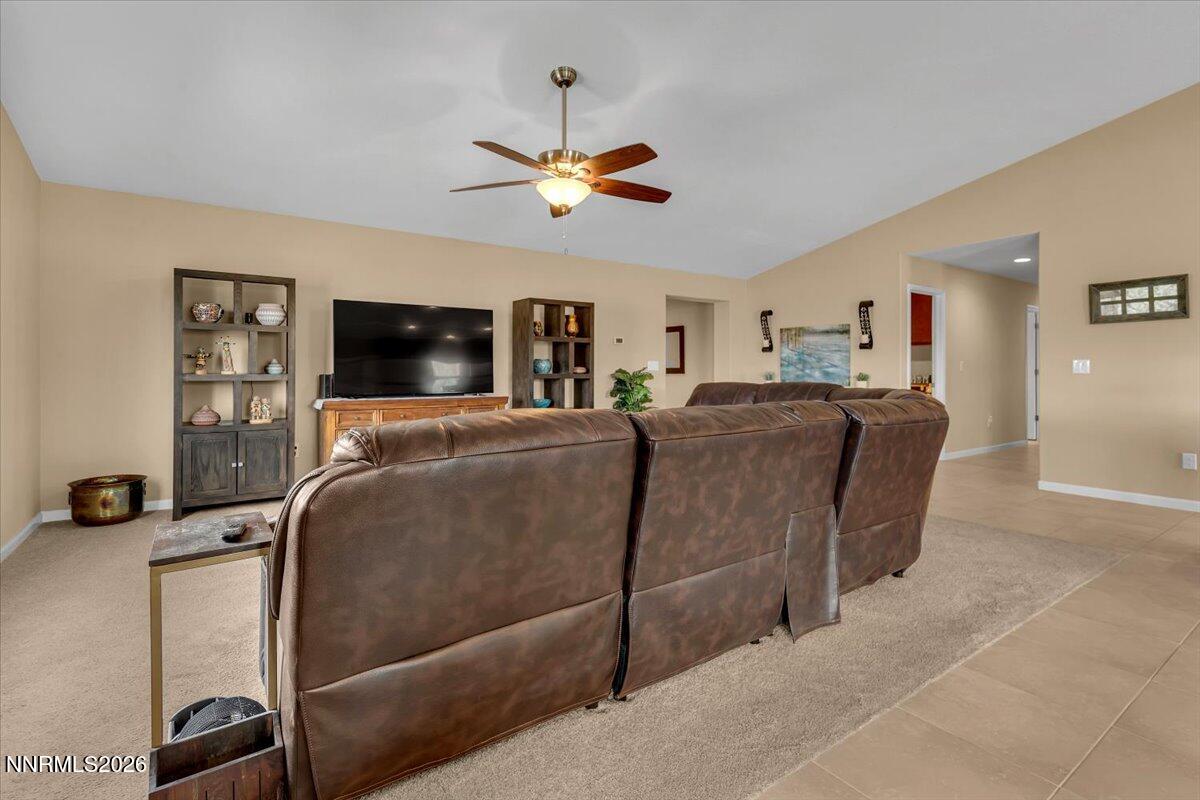 104 Bethpage Road Dayton, NV 89403 - Photo 6 of 65 a living room with a couch and a flat screen tv