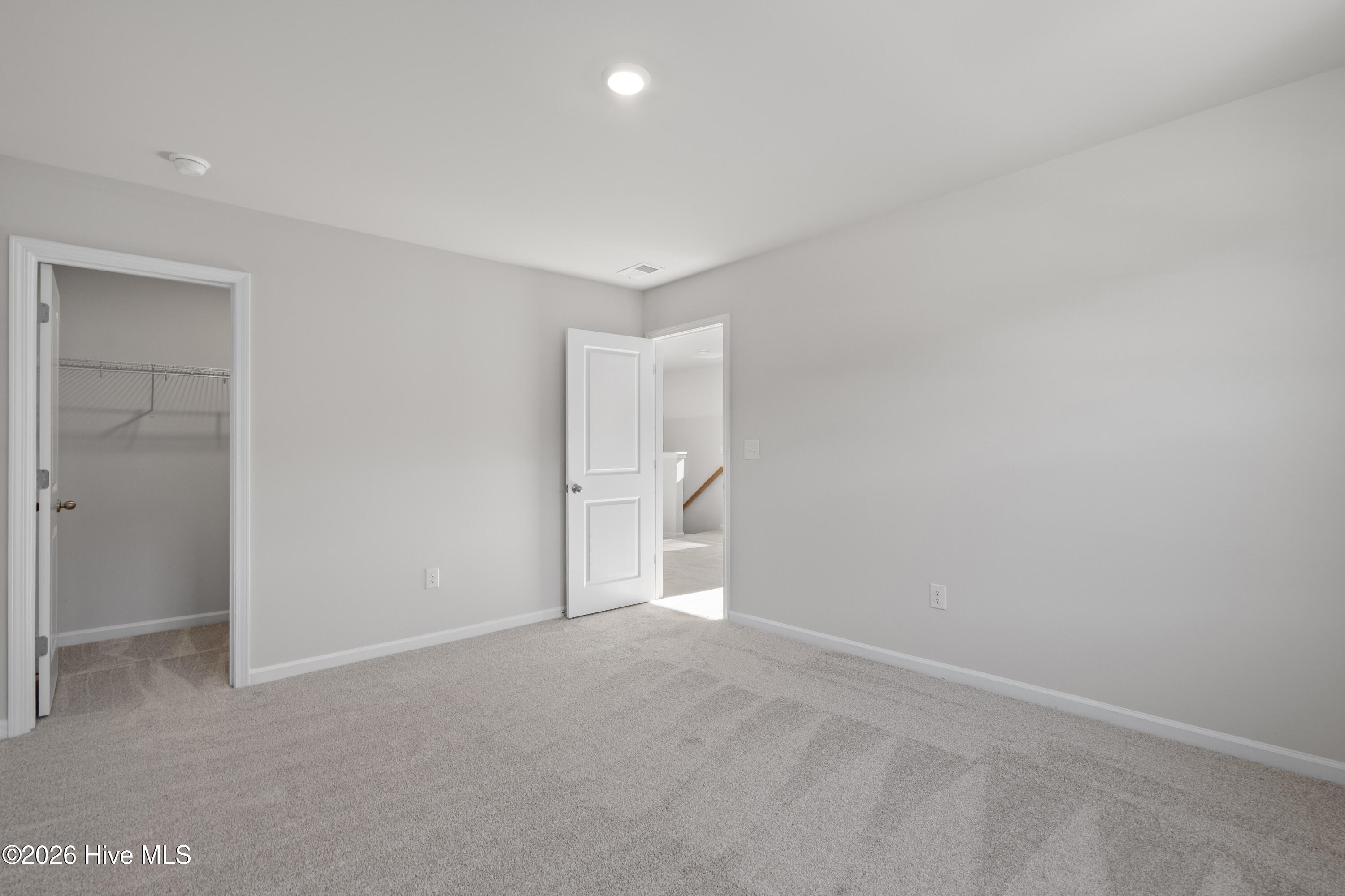 824 Palm Frond Way Calabash, NC 28467 - Photo 24 of 31 Upstairs front bedroom showing walk-in closet