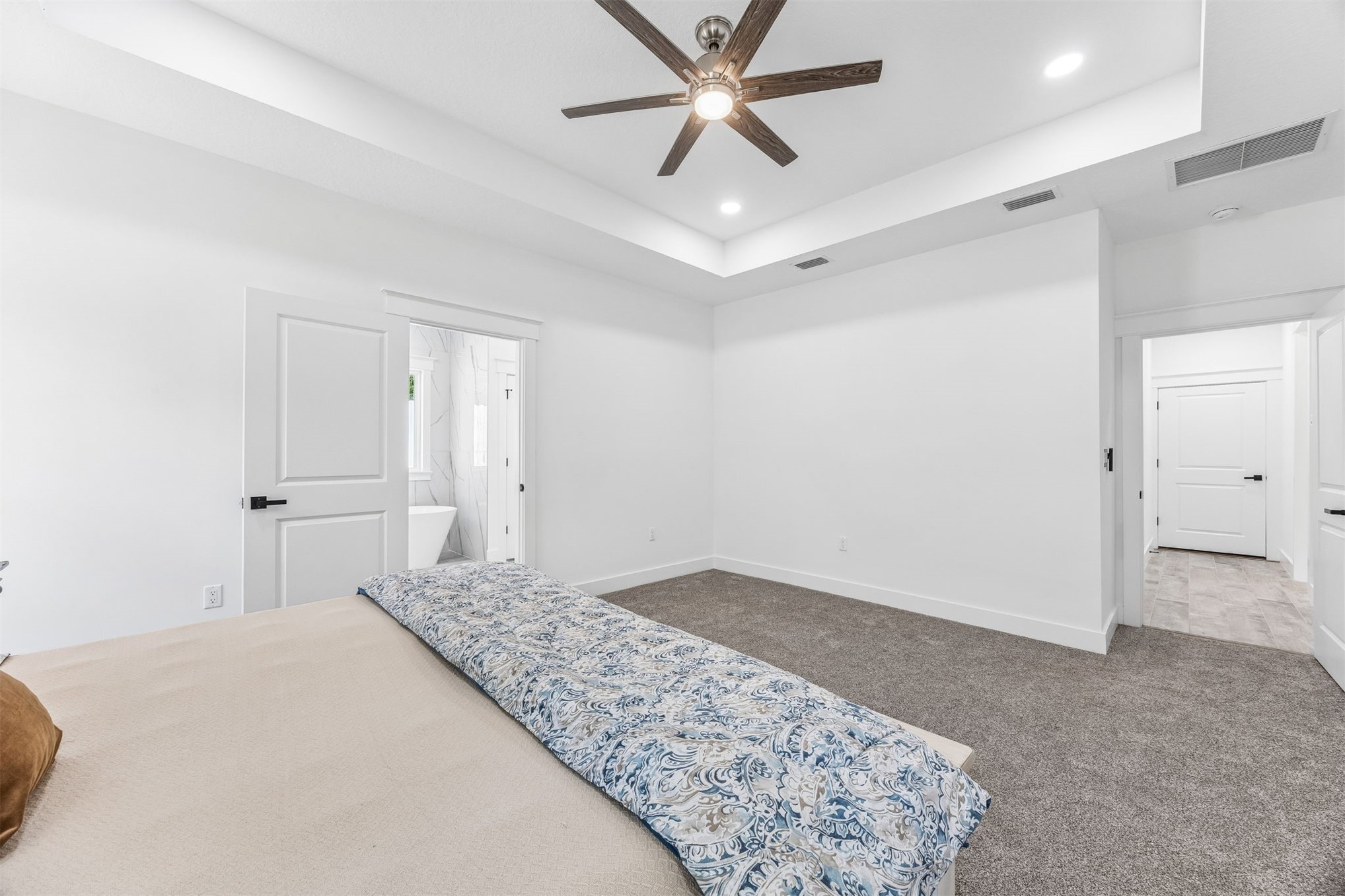 95121 North Ellis Landing Road Fernandina Beach, FL 32034 - Photo 18 of 37 a bedroom with a bed and a ceiling fan