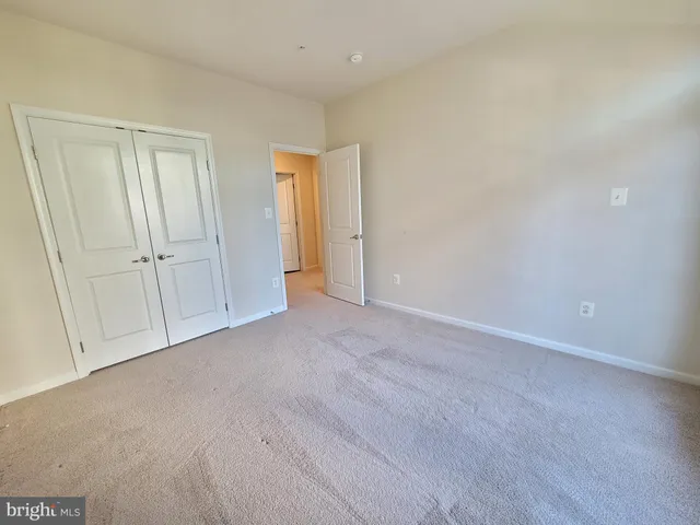 a view of an empty room and entryway