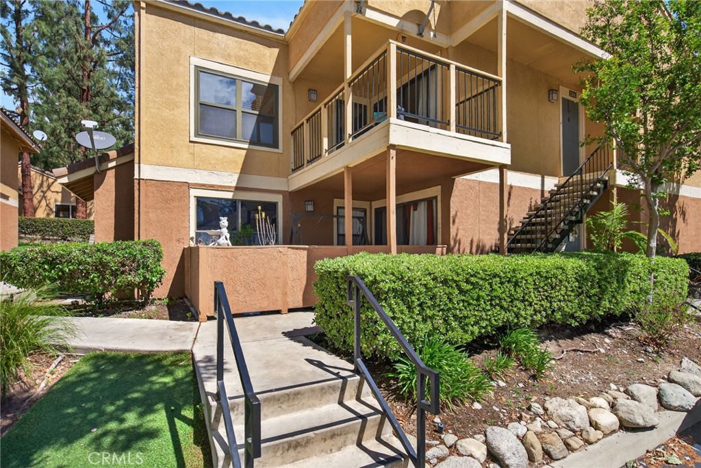 10655 Lemon Avenue, Unit 1304 Rancho Cucamonga, CA 91737 - Photo 1 of 38 a front view of a house with a yard