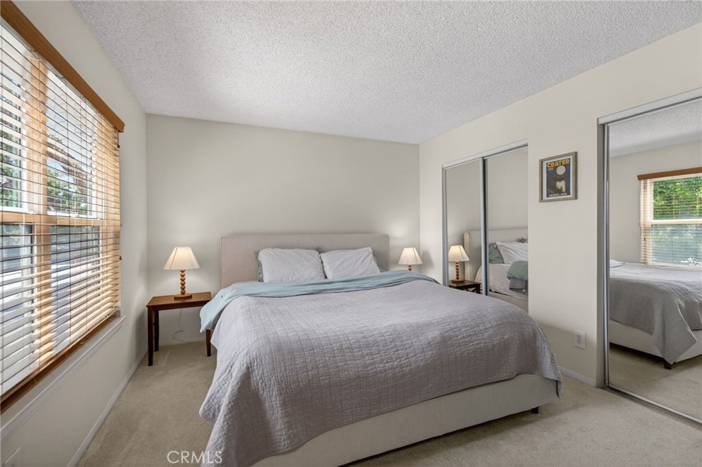 10655 Lemon Avenue, Unit 1304 Rancho Cucamonga, CA 91737 - Photo 11 of 38 a bedroom with a bed and a large window