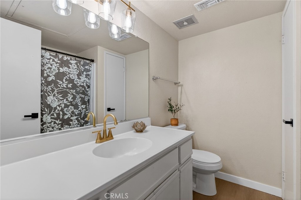 10655 Lemon Avenue, Unit 1304 Rancho Cucamonga, CA 91737 - Photo 13 of 38 a bathroom with a sink toilet and shower