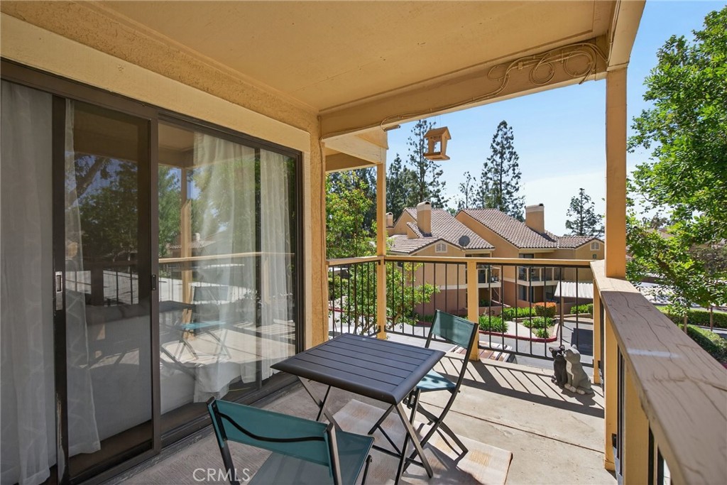 10655 Lemon Avenue, Unit 1304 Rancho Cucamonga, CA 91737 - Photo 19 of 38 a view of a chairs and table in patio with a fire pit