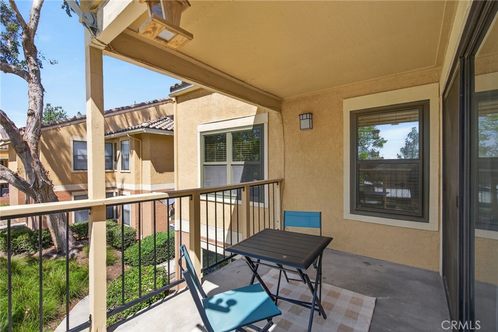 10655 Lemon Avenue, Unit 1304 Rancho Cucamonga, CA 91737 - Photo 20 of 38 a view of a chair and table in the balcony