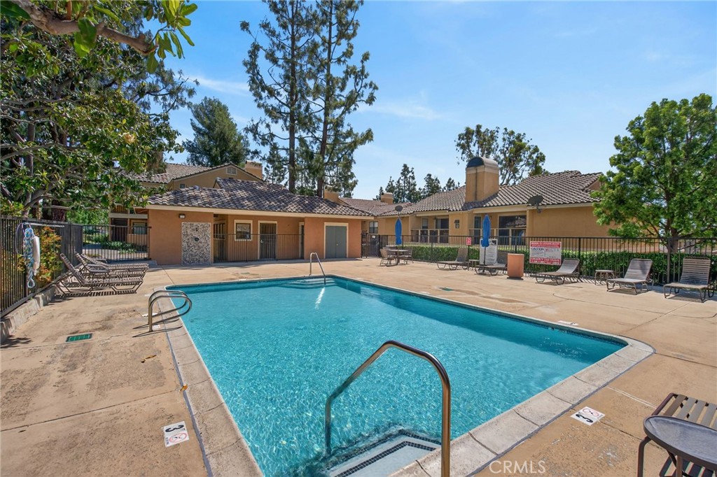 10655 Lemon Avenue, Unit 1304 Rancho Cucamonga, CA 91737 - Photo 26 of 38 a view of house with swimming pool outdoor seating