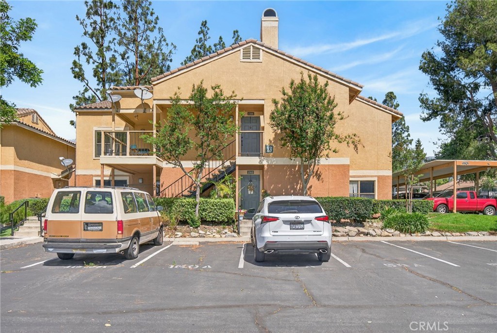 10655 Lemon Avenue, Unit 1304 Rancho Cucamonga, CA 91737 - Photo 31 of 38 a car parked in front of a house