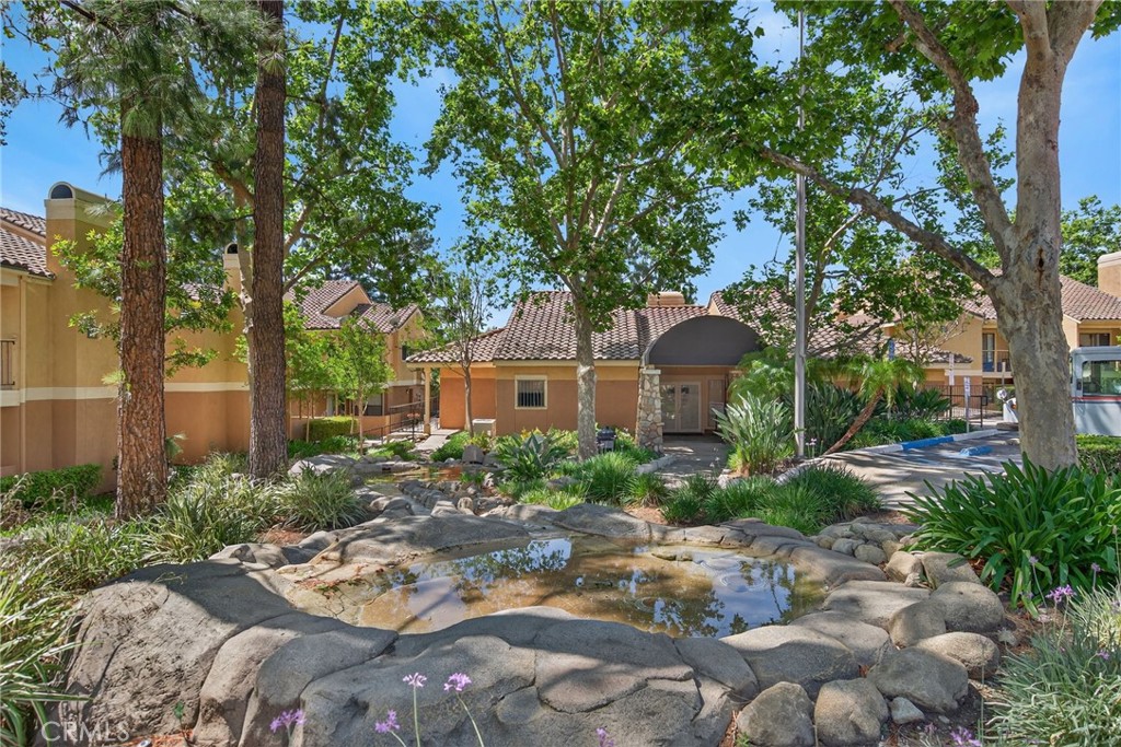 10655 Lemon Avenue, Unit 1304 Rancho Cucamonga, CA 91737 - Photo 32 of 38 a front view of a house with garden