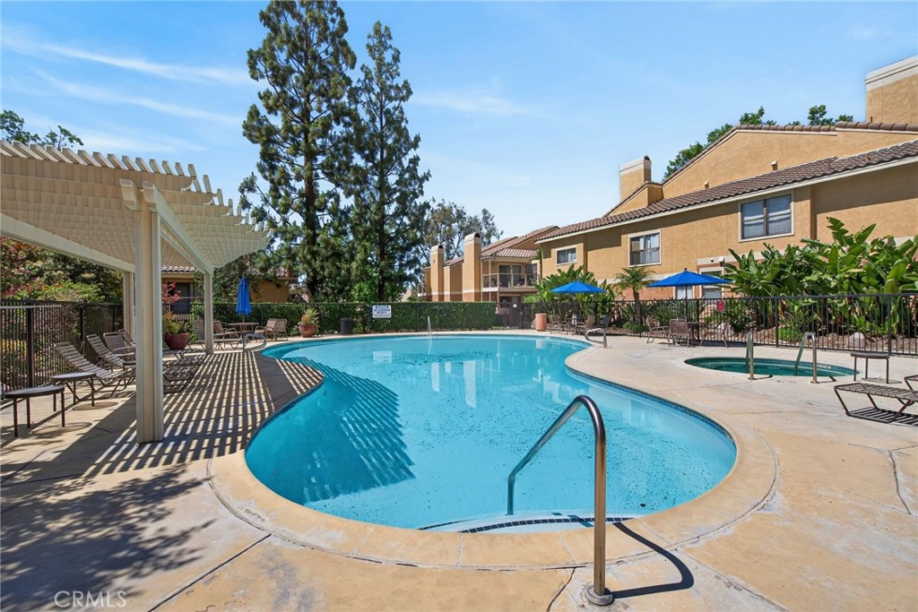 10655 Lemon Avenue, Unit 1304 Rancho Cucamonga, CA 91737 - Photo 34 of 38 a view of a swimming pool with a patio
