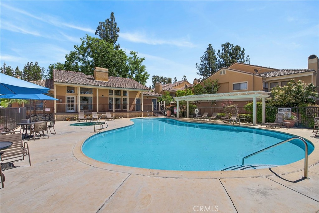 10655 Lemon Avenue, Unit 1304 Rancho Cucamonga, CA 91737 - Photo 35 of 38 a view of outdoor space yard swimming pool and patio