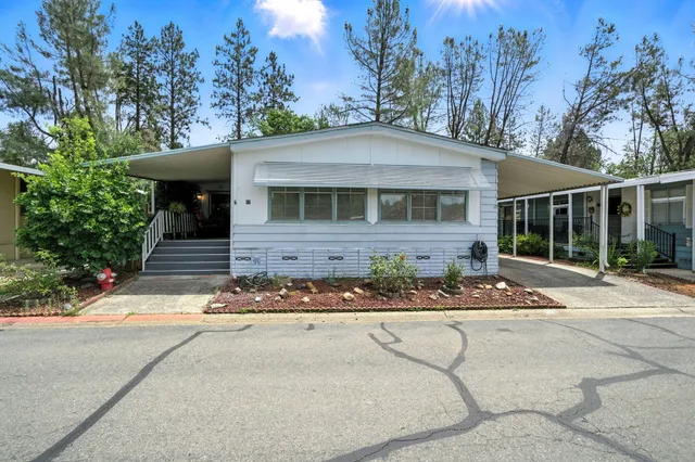 a front view of a house with yard