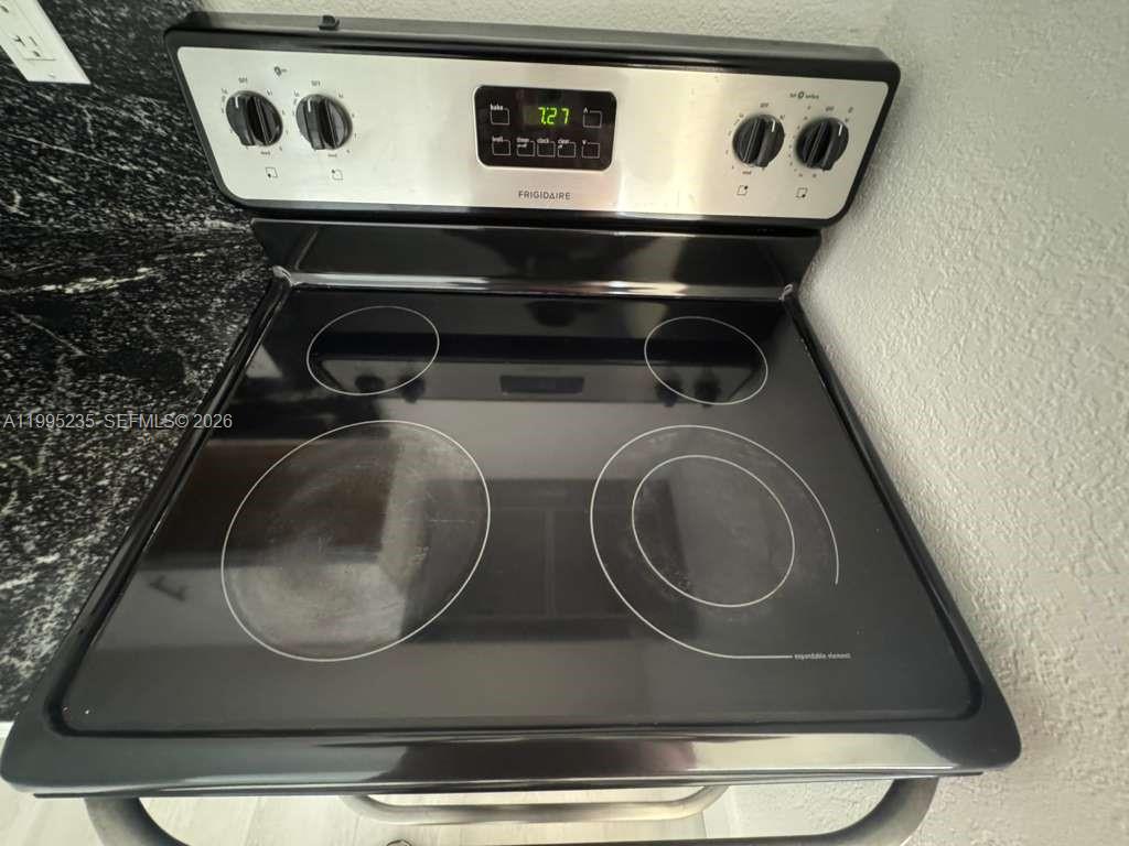 230 East 56th Street, Unit A Hialeah, FL 33013 - Photo 16 of 25 a washer and dryer sitting on a sink