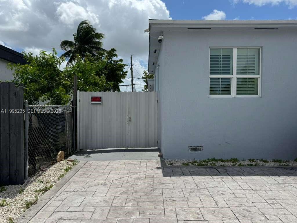 230 East 56th Street, Unit A Hialeah, FL 33013 - Photo 2 of 25 a view of backyard with potted plants