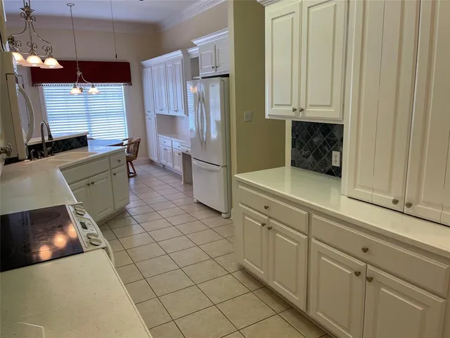 a room with cabinets and wooden floor