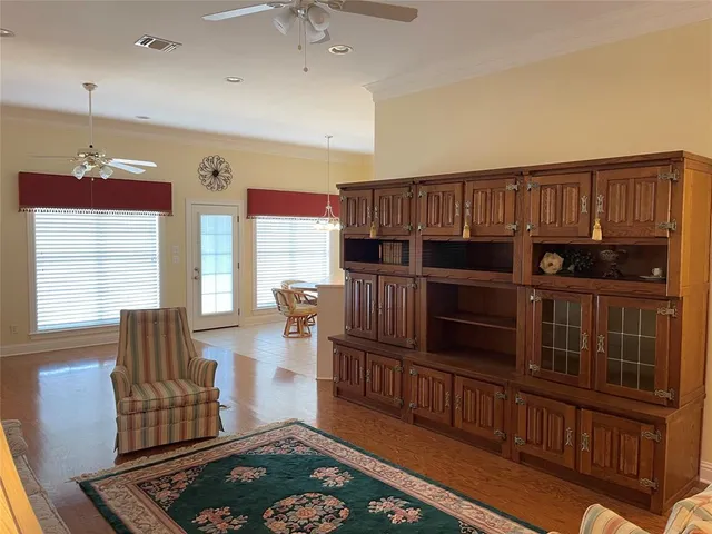 a kitchen with stainless steel appliances kitchen island granite countertop furniture and a refrigerator