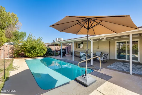 a view of a house with a swimming pool