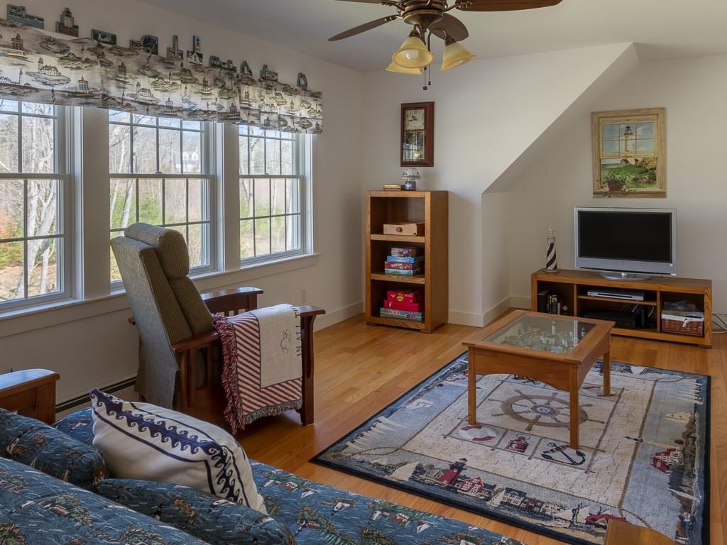 86 Spring Hill Loop Chamberlain, ME 04541 - Photo 16 of 35 Second floor family area.
