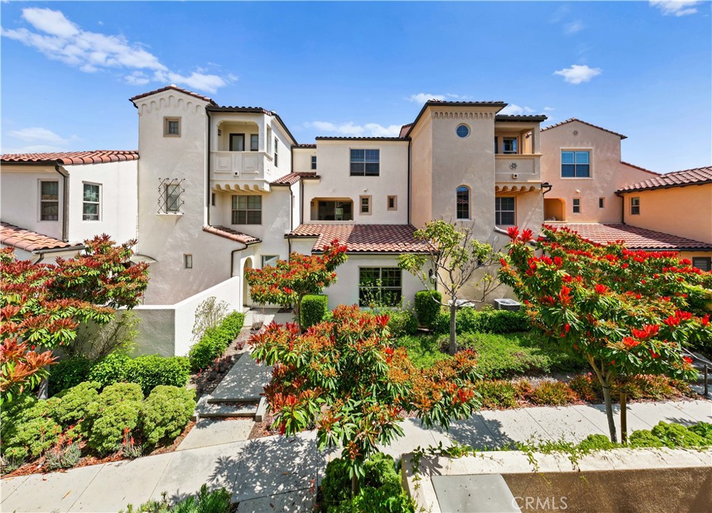 118 Rye Grass Irvine, CA 92618 - Photo 1 of 1 front view of a house with a yard and a fountain