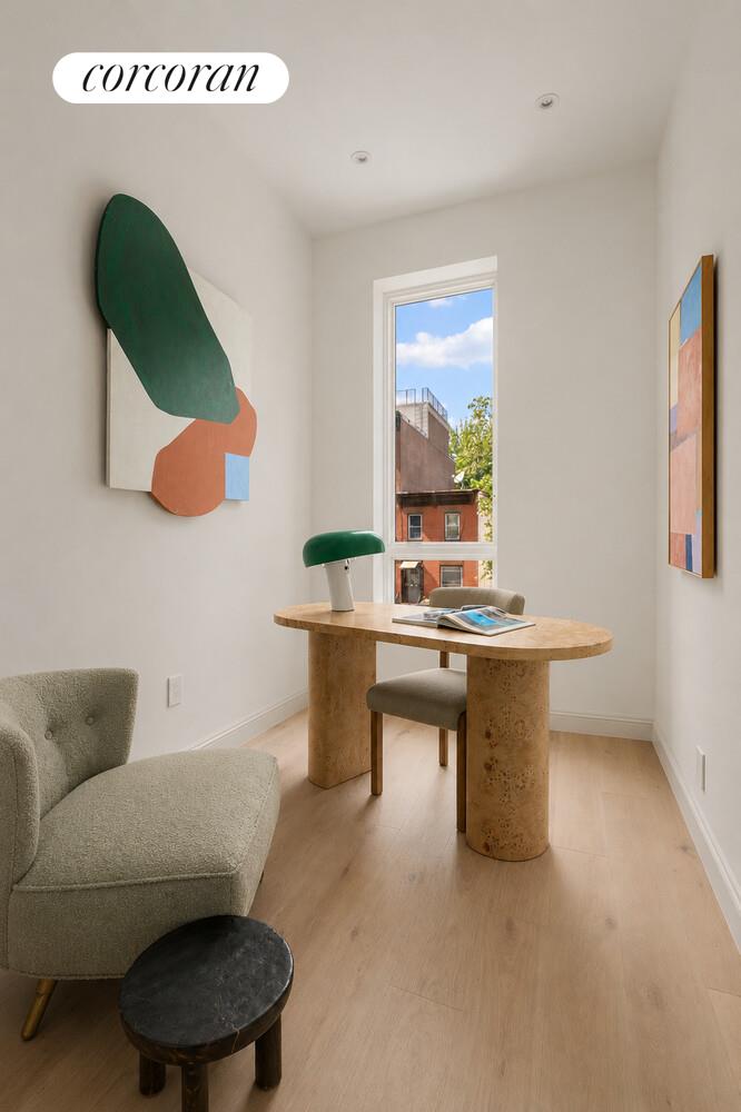 700 Monroe Street Brooklyn, NY 11221 - Photo 14 of 18 a living room with furniture and a window
